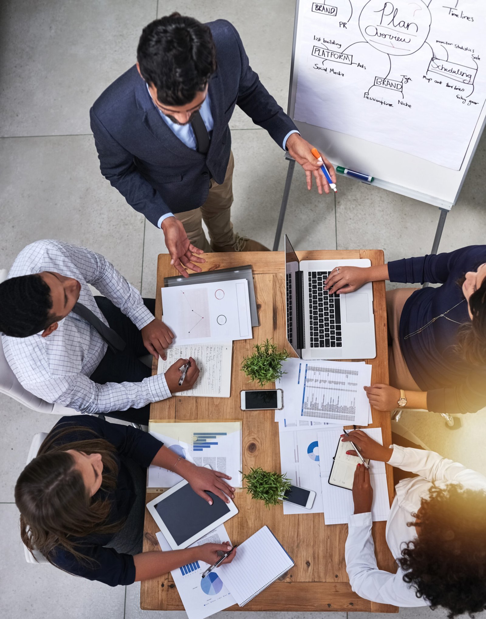 Business people, teamwork and presentation with planning for finance with tax audit, company budget or above. Accounting, auditor or collaboration with sales report, statistics and annual data graphs.